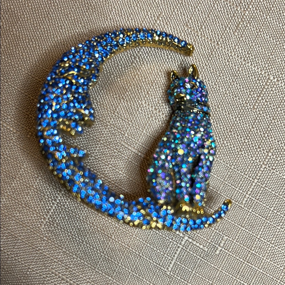 BETSEY Johnson’s Sparkling Blue and Gold Cat Brooch